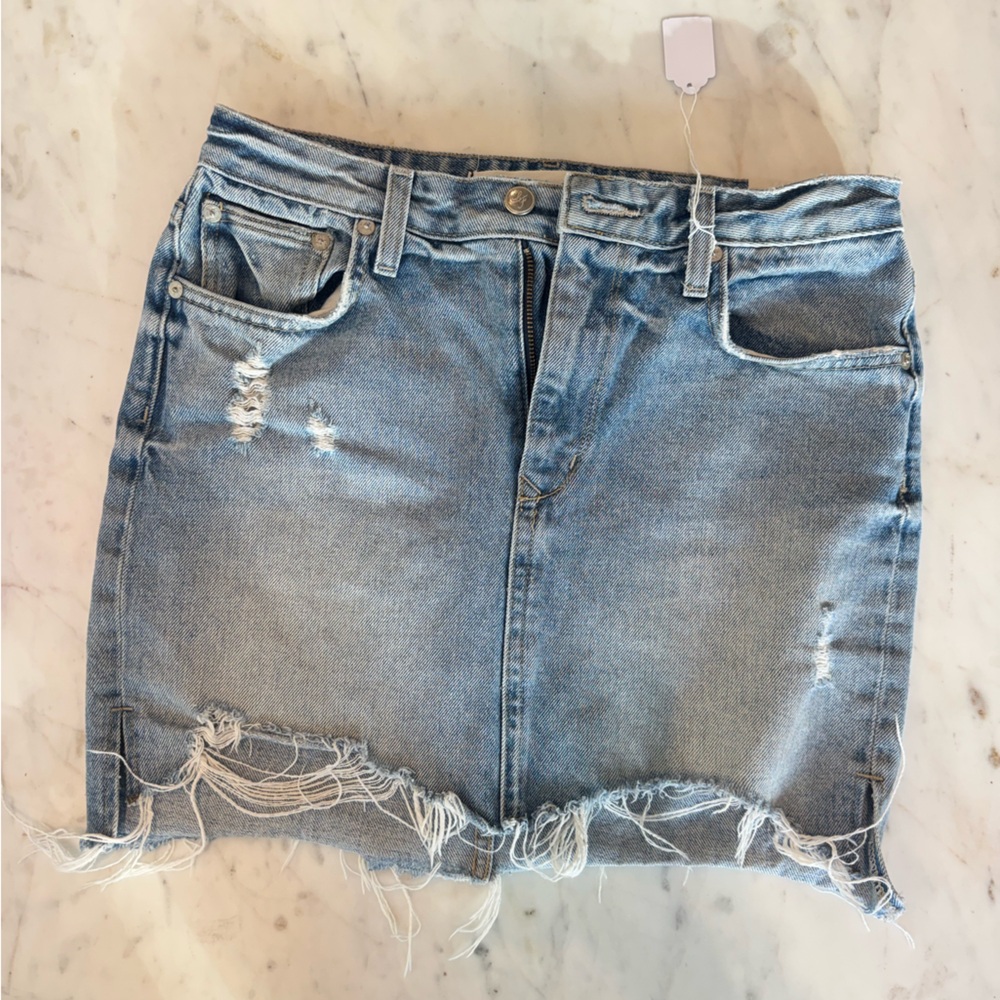 Distressed denim mini skirt
